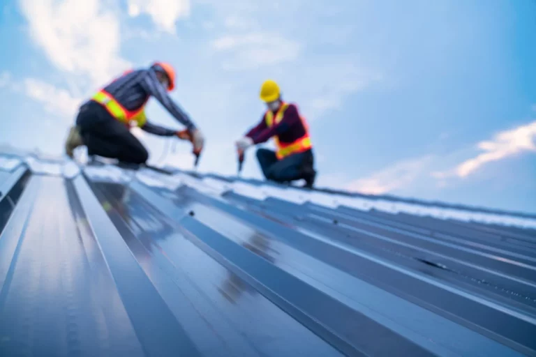 roofing contractors installing new metal roof